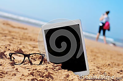 Eyeglasses and tablet with black blank space in the screen, in t Stock Photo