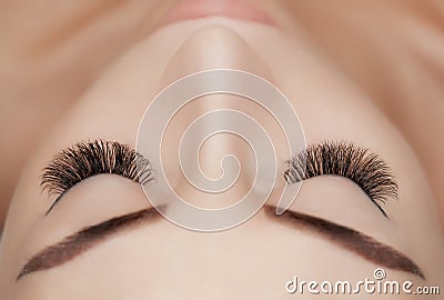 Eyelash extension procedure close up. Stock Photo