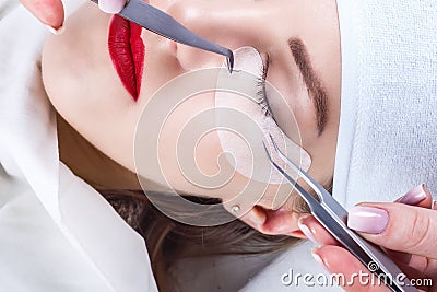 Eyelash Extension Procedure. Woman Eye with Long Eyelashes. Lashes, close up, selected focus. Stock Photo