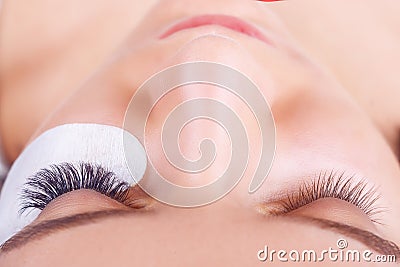 Eyelash Extension Procedure. Woman Eye with Long Eyelashes. Lashes, close up, selected focus. Stock Photo