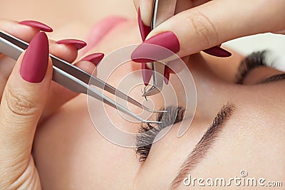 Eyelash removal procedure close up. Beautiful Woman with long lashes Stock Photo