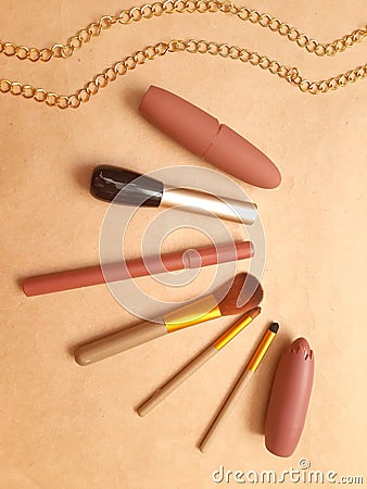 Cosmetics and gold chains Stock Photo