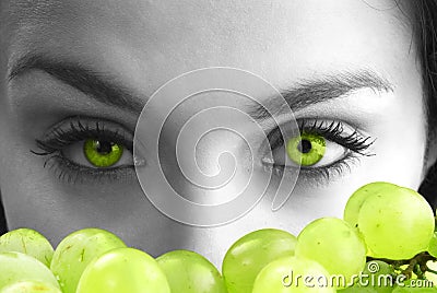 Eyes and grape Stock Photo