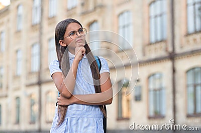 eyesight of pondering school girl outdoor. eyesight photo of teenage school girl. Stock Photo