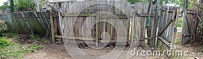 Eyesore Ramshackle Fence in Alley Stock Photo