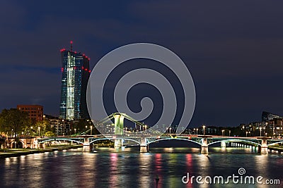 The EZB building in Frankfurt during blue hour with a lit bridge Stock Photo