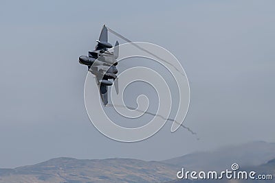 F-15E Strike Eagle flying through the Mach Loop Editorial Stock Photo