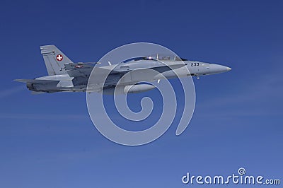 FA-18 military jet from Swiss Airforce up in the air above the s Editorial Stock Photo