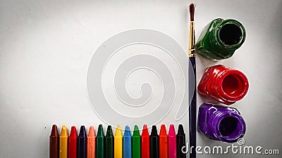 Fabric colours and Crayons placed in a white background Stock Photo