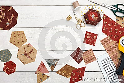 Fabric pieces of different geometric shapes for sewing quilt, traditional patchwork, sewing and quilting accessories Stock Photo