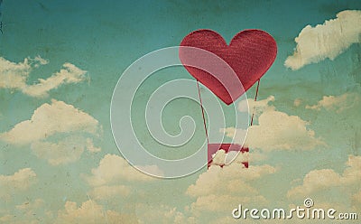 Fabric red heart air balloon on blue sky background Stock Photo