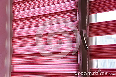 Fabric roller blinds on the window. Stock Photo