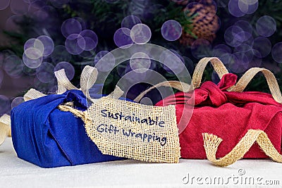 Fabric wrapping for gifts, sustainable living concept, zero waste, recycle, reuse, sustainable gift wrapping text Stock Photo