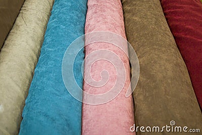 Fabricate silk and cloth on the shop shelf, rolled silk in the market, multicolor and many pattern texture background Stock Photo