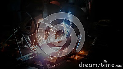 Fabricator welding a frame Stock Photo