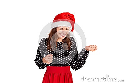 Fabulous joyful woman showing tongue and looking down laughs. emotional girl in santa claus christmas hat isolated on white backgr Stock Photo