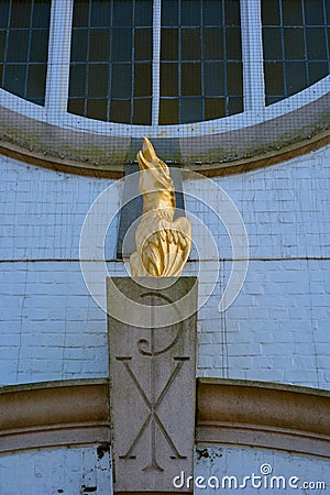 Golden Fenix statue and pax christi symbol, sign Stock Photo