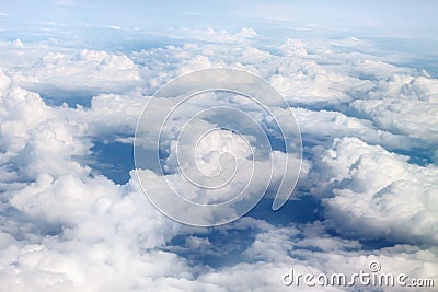 Fabulous, white clouds and blue sky. View from the airplane window Stock Photo