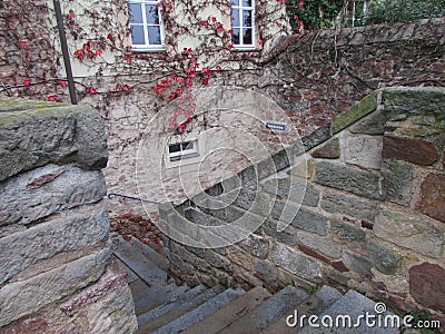 Fabulously beautiful old staircase of colored wild stone in Mason. Stock Photo