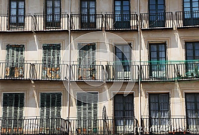 Facade of an ancient building, with rows of balconies Stock Photo