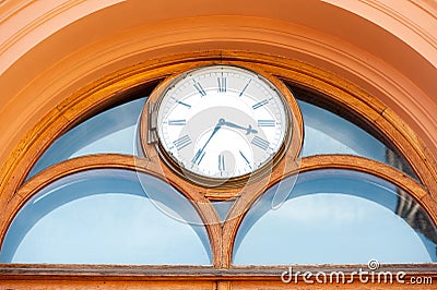 Facade ancient clock in old town. Riga, Latvia, Baltic states. Stock Photo