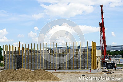 The facade of a building built of building blocks with wooden laths for attaching decorative panels Stock Photo