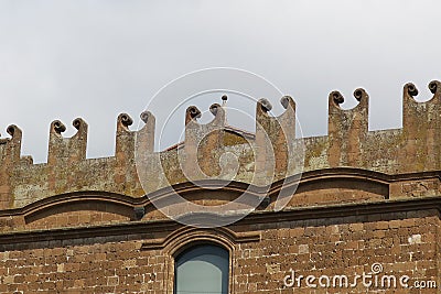 Facade of a building with curling ornaments in Orvieto Italy Stock Photo