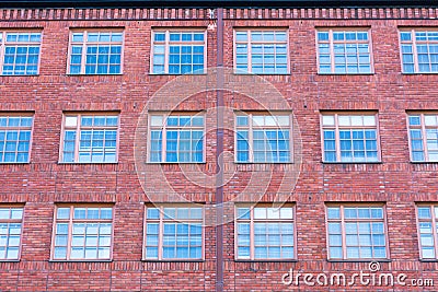 Facade of the building with large lattice windows Stock Photo
