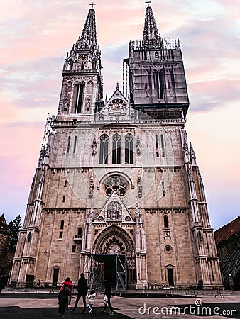 Facade of Cathedral of Zagreb on sunset sky background in Zagreb, Croatia Editorial Stock Photo