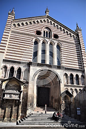 Facade of the church of San Fermo Maggiore looking at the statue, which is located beyond the street in front, of Umberto I. Stock Photo