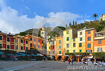 15.03.2018. facade of colorful old buildings and architecture with people walking on dock in small coastal village Portofino in Li Stock Photo
