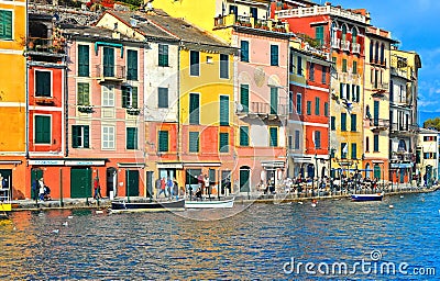 15.03.2018. facade of colorful old buildings and architecture with people walking on dock in small coastal village Portofino in Li Editorial Stock Photo