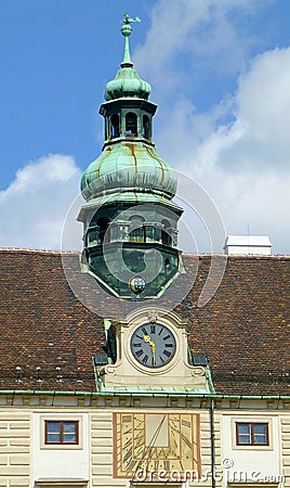 Facade element of Amalienburg Palace with mechanical and sundial, Vienna, Austria Stock Photo