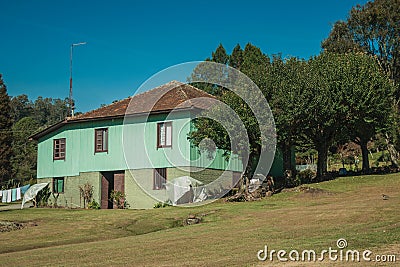 Facade with entrance of old charming cottage Stock Photo