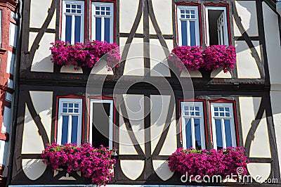 Facade of Fachwerkhaus with flowers in Germany Stock Photo