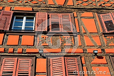 Facade of fachwerkhaus, or timber framing, in Riquewihr village, Alsace, France Stock Photo