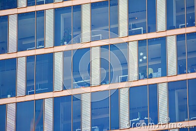 Modern office building facade abstract fragment, shiny windows in steel structure. Stock Photo