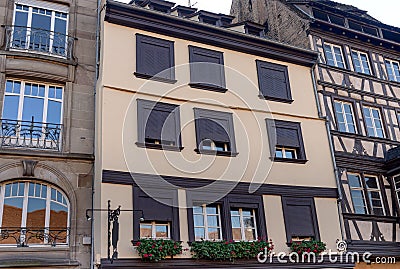 The facade of french building modern style with windows and french balconies Stock Photo