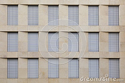 Facade of office building with closed shutter blinds Stock Photo