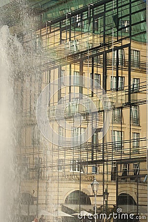 Facade of glass of the Academy of Arts in Berlin with mirror image of the Hotel Adlon at the Brandenburg Gate and Pariser Platz Stock Photo