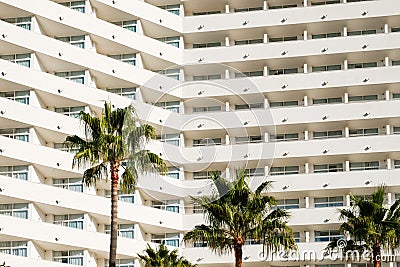 Facade hotel or apartment building palm trees Stock Photo