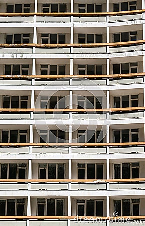 The facade of a hotel. The apartments of the hotel. The terraces of the apartments. An abandoned hotel Stock Photo