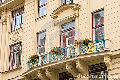 Facade of the house of classical European architecture of the old cozy tourist city. Background Stock Photo
