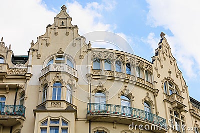 Facade of the house of classical European architecture of the old cozy tourist city. Background Stock Photo