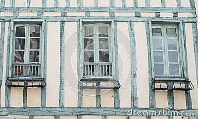 Facade of house in the old style. Typical old wall with wood beams and vintage windows in France Stock Photo