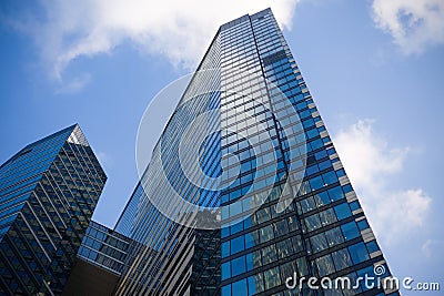 Facade of a narrow glass skyscraper Editorial Stock Photo