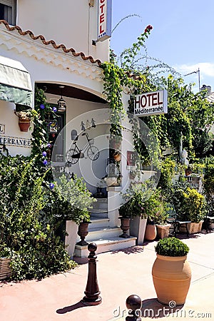 Facade of a nice little hotel in Saintes-Maries-de-la-Mer Editorial Stock Photo