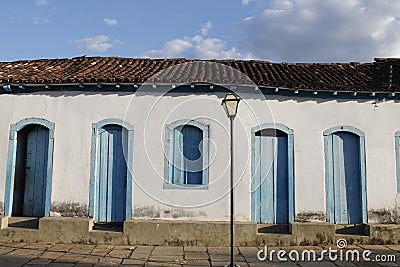 Facade of an old colonial house in central Brazil.Traditional house in Pirenopolis, window historic Brazil, lamppost. Stock Photo