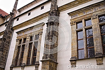 Facade of an old stone building with framed black windows Prague, Czech Republic Stock Photo