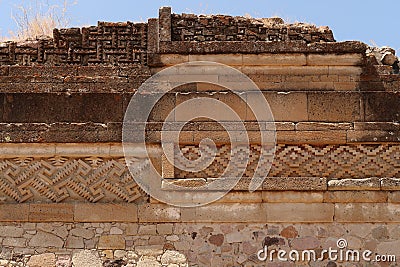 Facade of one of the temples of the Group of Columns, many different materials, layers, patterns and styles, Mitla, Mexico Stock Photo